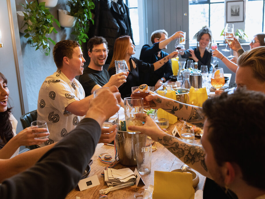 Fiasco Design turns 13! Image shows Fiasco team 'cheers'ing