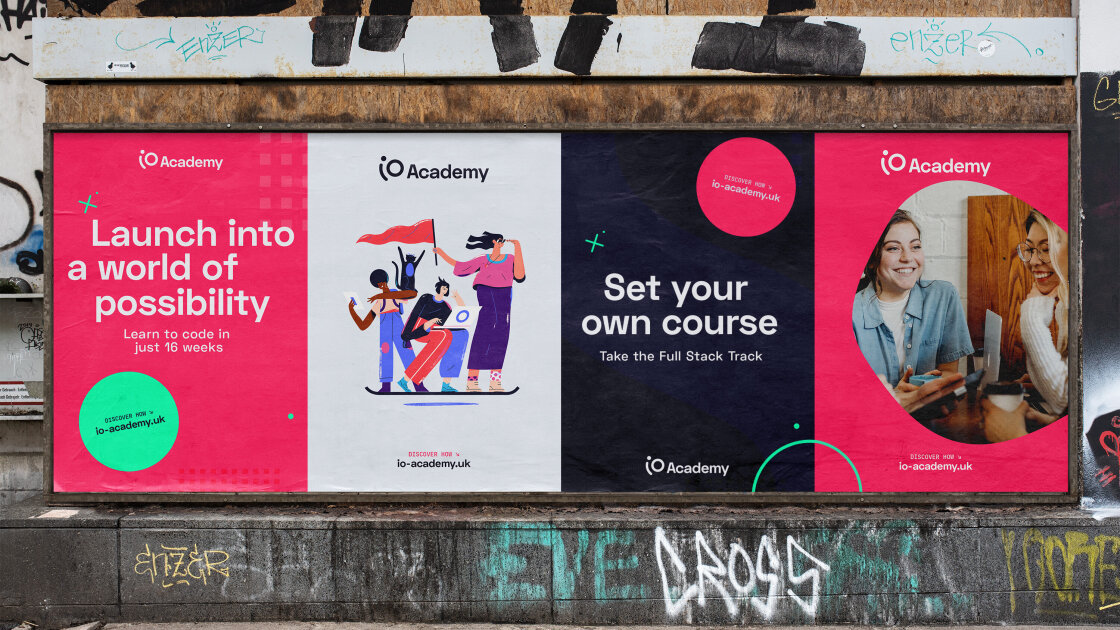 iO Academy 6-sheet urban mock up. Four 6-sheet adverts are shown in an urban setting with concrete pavement and graffiti. The iO Academy logo is prominent on each. The logo features a curved lower case 'i' and and uppercase 'O'. The wordmark is in sentence case in Sharp Grotesk. The adverts either feature a headline, hero illustration, or image cropped within a circular shape. The illustration features a group of people hover-boarding. They represent a diverse group of people, they have varied hair and skin colours, their clothing has tones of blue, purple, pink and red. They are using a laptop and tablet device. A 'Discover how' call to action and weblink features in addition to circular and x-shaped graphic elements.