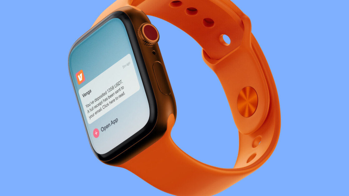 Venga smart watch notification mock up. The Venga logo is visible above the deposit notification. On the screen underneath there is a prompt to open the app. The watch strap is orange and the watch is floating against a blue background.